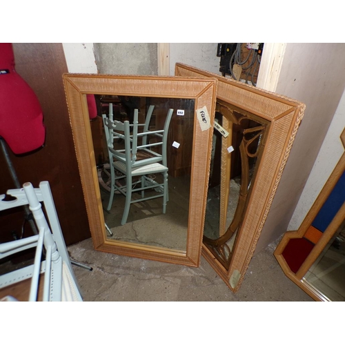 692 - TWO WICKER FRAMED MIRRORS