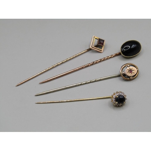 1396 - 15ct CABOCHON SET PIN AND THREE 9ct GOLD STONE SET PINS