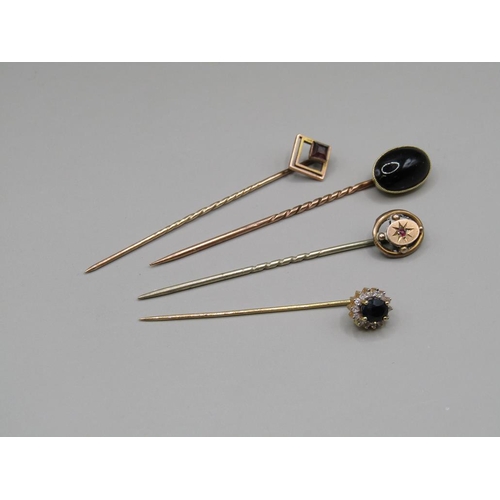 1396 - 15ct CABOCHON SET PIN AND THREE 9ct GOLD STONE SET PINS