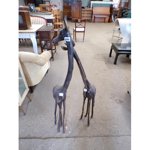 694 - TWO WOODEN GIRAFFES