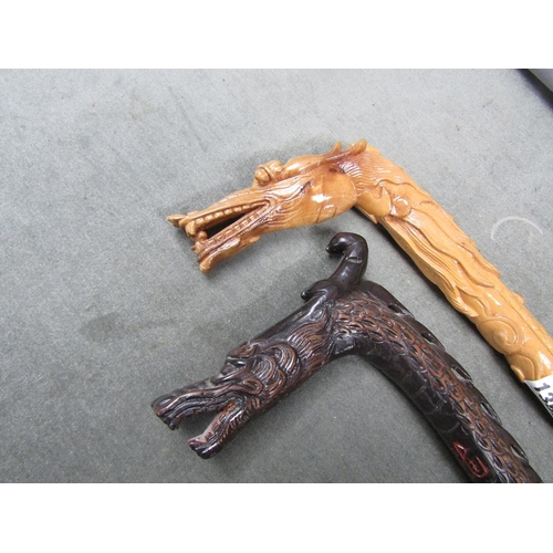 1352 - TWO ORIENTAL WALKING STICKS - ONE IN FORM OF A DRAGON, 87CM L