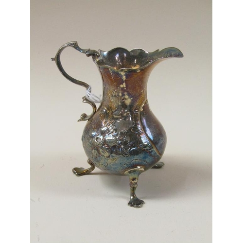 1672 - LATE GEORGIAN SILVER CREAM JUG WITH EMBOSSED AND CHASED DECORATION