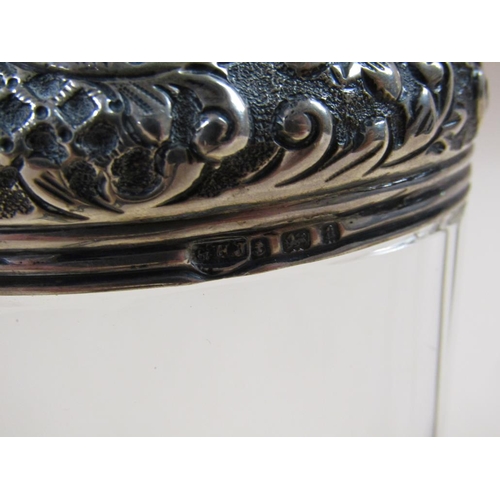 1693 - SIX CUT GLASS COSMETIC AND SCENT BOTTLES WITH SILVER COVERS