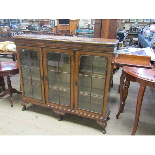 1951 - FIGURED WALNUT VENEERED GEORGIAN STYLE STANDING SIDE CABINET ENCLOSED BY THREE HINGED DOORS, 131CM W... 