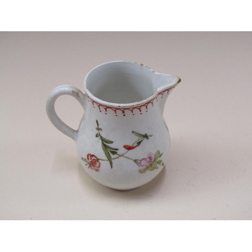 174 - An 18c English creamware sparrow beak jug, hand painted floral decoration, a/f, 8cm h.