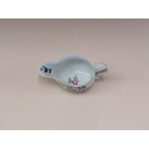 178 - An 18c Moulded cream jug, hand painted with flowers, 6cm h.