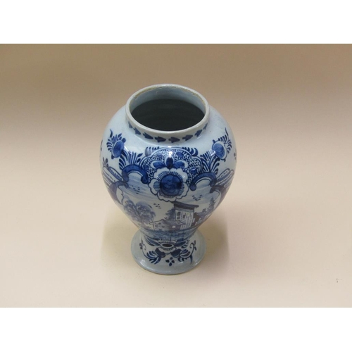 179 - A 19c Delft blue and white vase of baluster form, 22cm h.