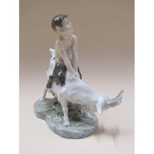 192 - A Royal Copenhagen model of a faun seated on goat, model no.737, 22cm h.