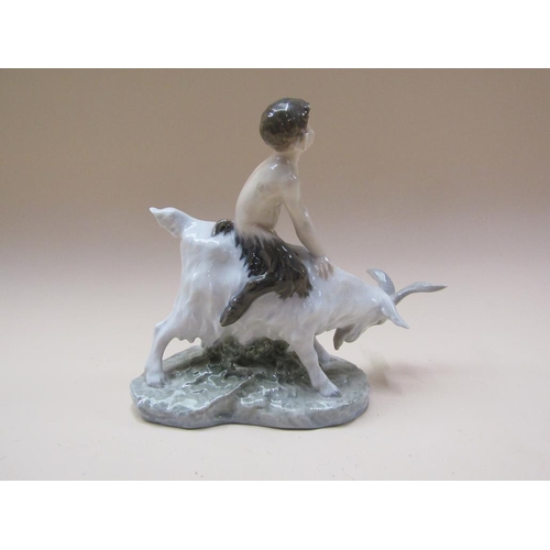 192 - A Royal Copenhagen model of a faun seated on goat, model no.737, 22cm h.