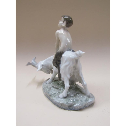 192 - A Royal Copenhagen model of a faun seated on goat, model no.737, 22cm h.