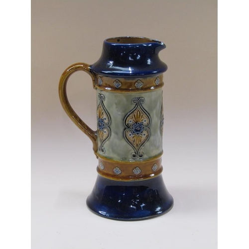 197 - A Doulton Lambeth stoneware ale jug with foliate design, retailed by W T Lamb & Sons, xmas 1912, 28c... 