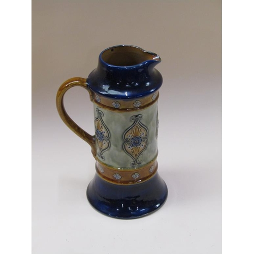 197 - A Doulton Lambeth stoneware ale jug with foliate design, retailed by W T Lamb & Sons, xmas 1912, 28c... 