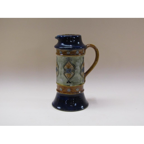 197 - A Doulton Lambeth stoneware ale jug with foliate design, retailed by W T Lamb & Sons, xmas 1912, 28c... 