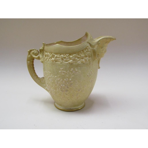 202 - A Doulton Burslem for Tiffany & Co relief moulded ivory jug, 17cm h.