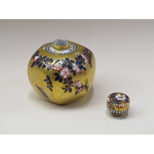 205 - An early 20c Coalport Imari canister and cover, floral decoration with butterflies on a gilded groun... 