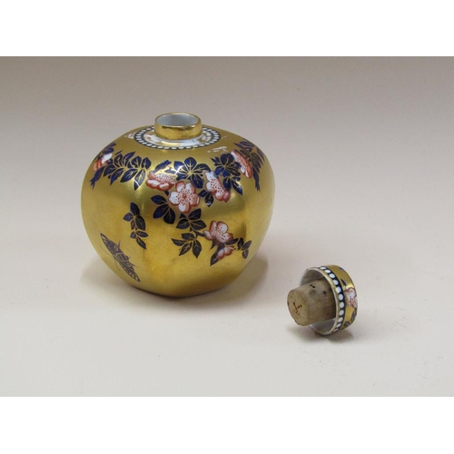 205 - An early 20c Coalport Imari canister and cover, floral decoration with butterflies on a gilded groun... 