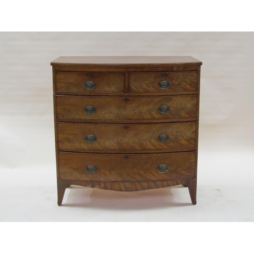 280 - An early 19c figured mahogany bow front chest of two short and three long graduated drawers with ova... 