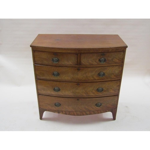 280 - An early 19c figured mahogany bow front chest of two short and three long graduated drawers with ova... 