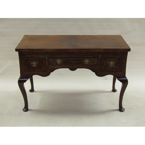 283 - A late 18c figured walnut veneered side table of rectangular form, cross banded and chequer line inl... 