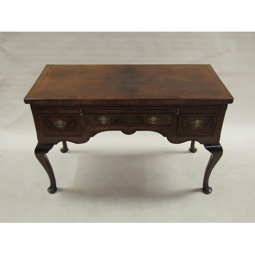 283 - A late 18c figured walnut veneered side table of rectangular form, cross banded and chequer line inl... 