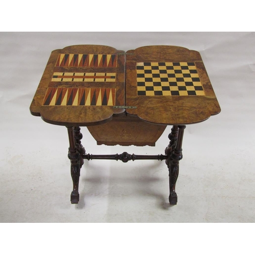 291 - A Victorian figured walnut metamorphic games/needlework table with marquetry inlay, supported on a s... 