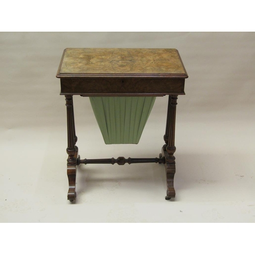 297 - A Victorian figured walnut needlework table of rectangular form with a hinged raised cover, quarter ... 