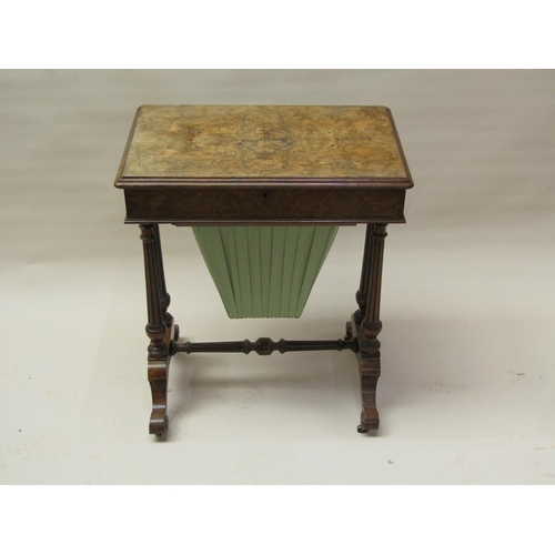 297 - A Victorian figured walnut needlework table of rectangular form with a hinged raised cover, quarter ... 