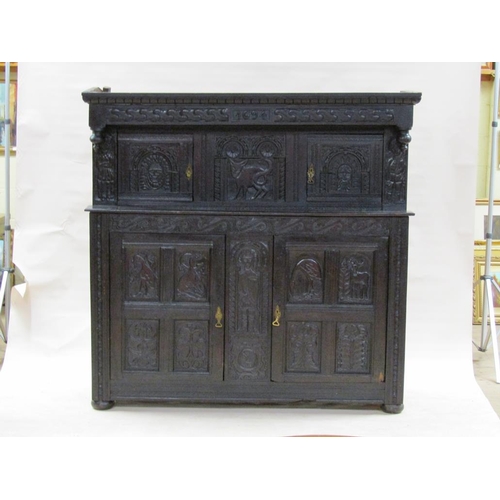 301 - An early 18c oak court cupboard, the upper section under a carved and moulded cornice with drop fini... 