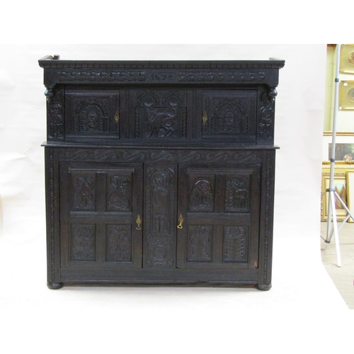 301 - An early 18c oak court cupboard, the upper section under a carved and moulded cornice with drop fini... 