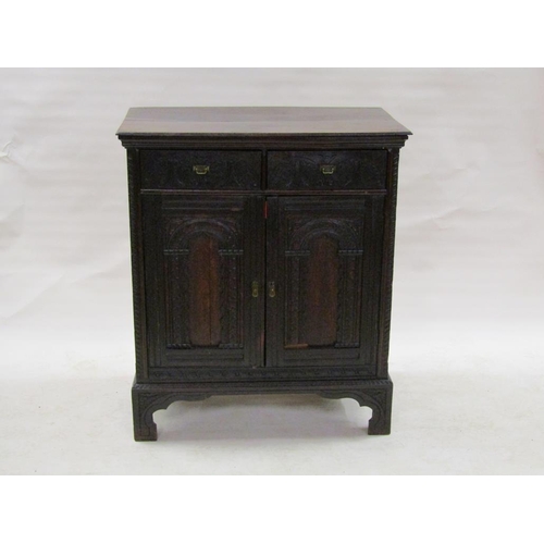 303 - A 19c oak side cabinet, fitted two upper drawers over a shelved cupboard enclosed by two arched pane... 