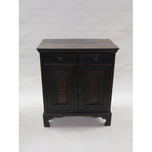 303 - A 19c oak side cabinet, fitted two upper drawers over a shelved cupboard enclosed by two arched pane... 