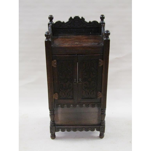 308 - A period oak side cupboard with a three quarter gallery, the back carved 'John Milton 1654', the cup... 