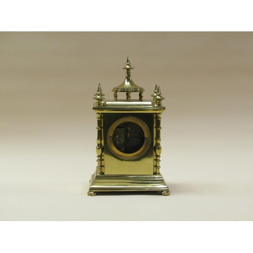 31 - A late 19c French mantel clock, the movement rack striking on a gong.  It is contained in a brass ca... 