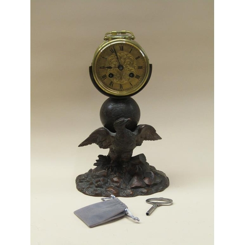 33 - A late 19c French drum mantel clock mounted on a carved wood stand (possibly Black Forest) depicting... 