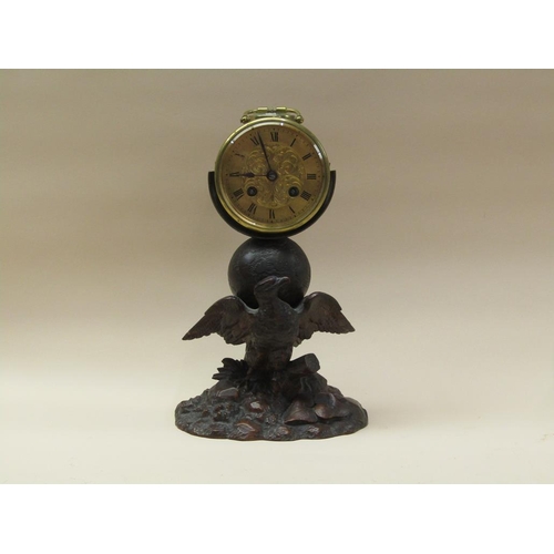 33 - A late 19c French drum mantel clock mounted on a carved wood stand (possibly Black Forest) depicting... 