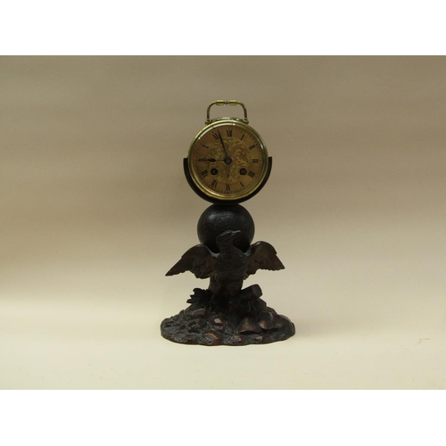 33 - A late 19c French drum mantel clock mounted on a carved wood stand (possibly Black Forest) depicting... 