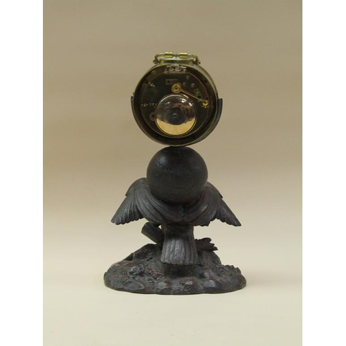 33 - A late 19c French drum mantel clock mounted on a carved wood stand (possibly Black Forest) depicting... 