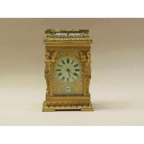 34 - A late 19c French carriage clock, the movement striking on a gong, and with an alarm and having a si... 