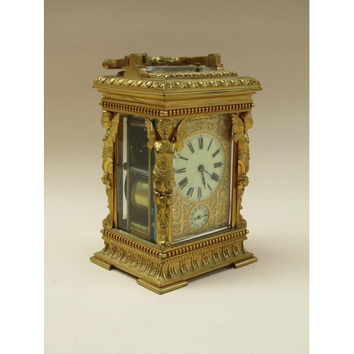 34 - A late 19c French carriage clock, the movement striking on a gong, and with an alarm and having a si... 