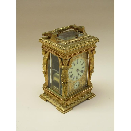 34 - A late 19c French carriage clock, the movement striking on a gong, and with an alarm and having a si... 