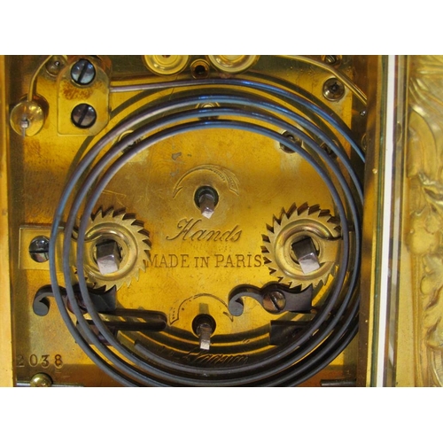 34 - A late 19c French carriage clock, the movement striking on a gong, and with an alarm and having a si... 