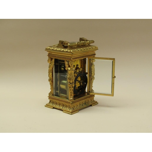 34 - A late 19c French carriage clock, the movement striking on a gong, and with an alarm and having a si... 