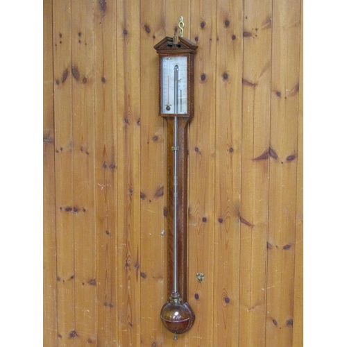 45 - A late 18c cistern barometer by J. Donegon & Co Bristol in a plain mahogany case with a chequer edge... 