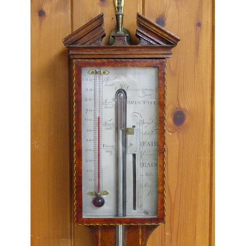 45 - A late 18c cistern barometer by J. Donegon & Co Bristol in a plain mahogany case with a chequer edge... 