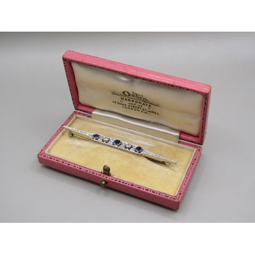 102 - An Art Deco period platinum diamond and sapphire set bar brooch, 7cm w.