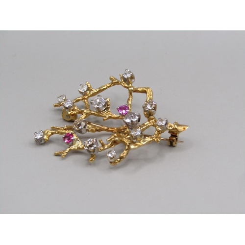 103 - A gold diamond and ruby set rustic branch brooch, 4.5cm w.