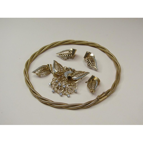 106 - A suite of 18ct gold diamond set jewellery comprising a rope twist necklace with a diamond set butte... 