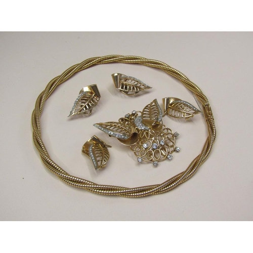 106 - A suite of 18ct gold diamond set jewellery comprising a rope twist necklace with a diamond set butte... 