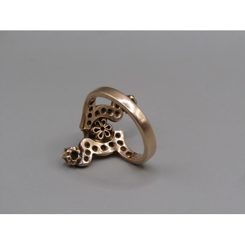 107 - A gold diamond set ring, size M.