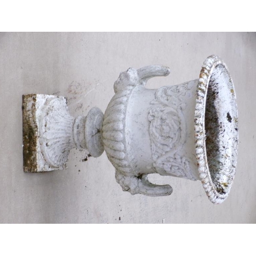 25 - A pair of cast iron campagna shaped urns, two handled, later white painted, on ring cast circular ba... 